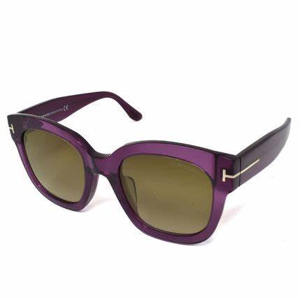 Lunettes de soleil Tom Ford FT0613 69K pour femme - monture bordeaux translucide, verres marron