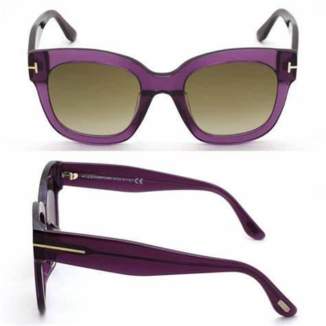 Lunettes de soleil Tom Ford FT0613 69K pour femme - monture bordeaux translucide, verres marron