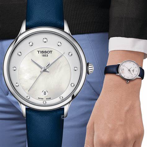 TISSOTTissot Odaci - T T1332101611600 Women's Watch – Mother of Pearl Dial, Diamond Indices, Blue Leather StrapWATCHESEcecile