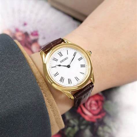 Seiko SWR072P1 Reloj de cuarzo para mujer, esfera blanca, caja dorada, correa de piel marrón