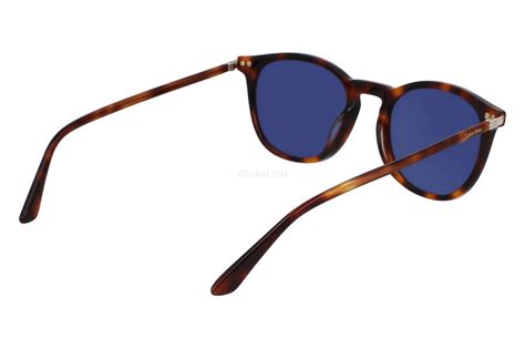 Calvin Klein CK22533S 220 52 Unisex runde Sonnenbrille - brauner Havanna-Rahmen, blaue Gläser