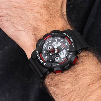 Casio G-SHOCK GA-100-1A4ER Men's Analog-Digital Watch – Black Resin Band with Red Accents, 200M Water Resistance