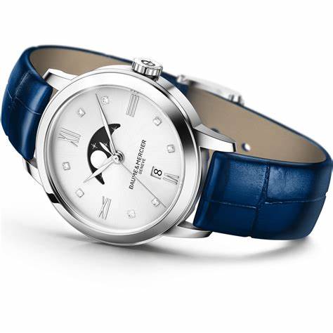 Baume & Mercier Classima M0A10329 Reloj de Cuarzo con Fases de la Luna para Mujer - 31mm Esfera plateada, índices de diamante, correa de aligátor azul