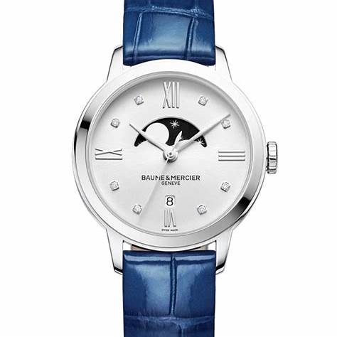Baume & Mercier Classima M0A10329 Reloj de Cuarzo con Fases de la Luna para Mujer - 31mm Esfera plateada, índices de diamante, correa de aligátor azul